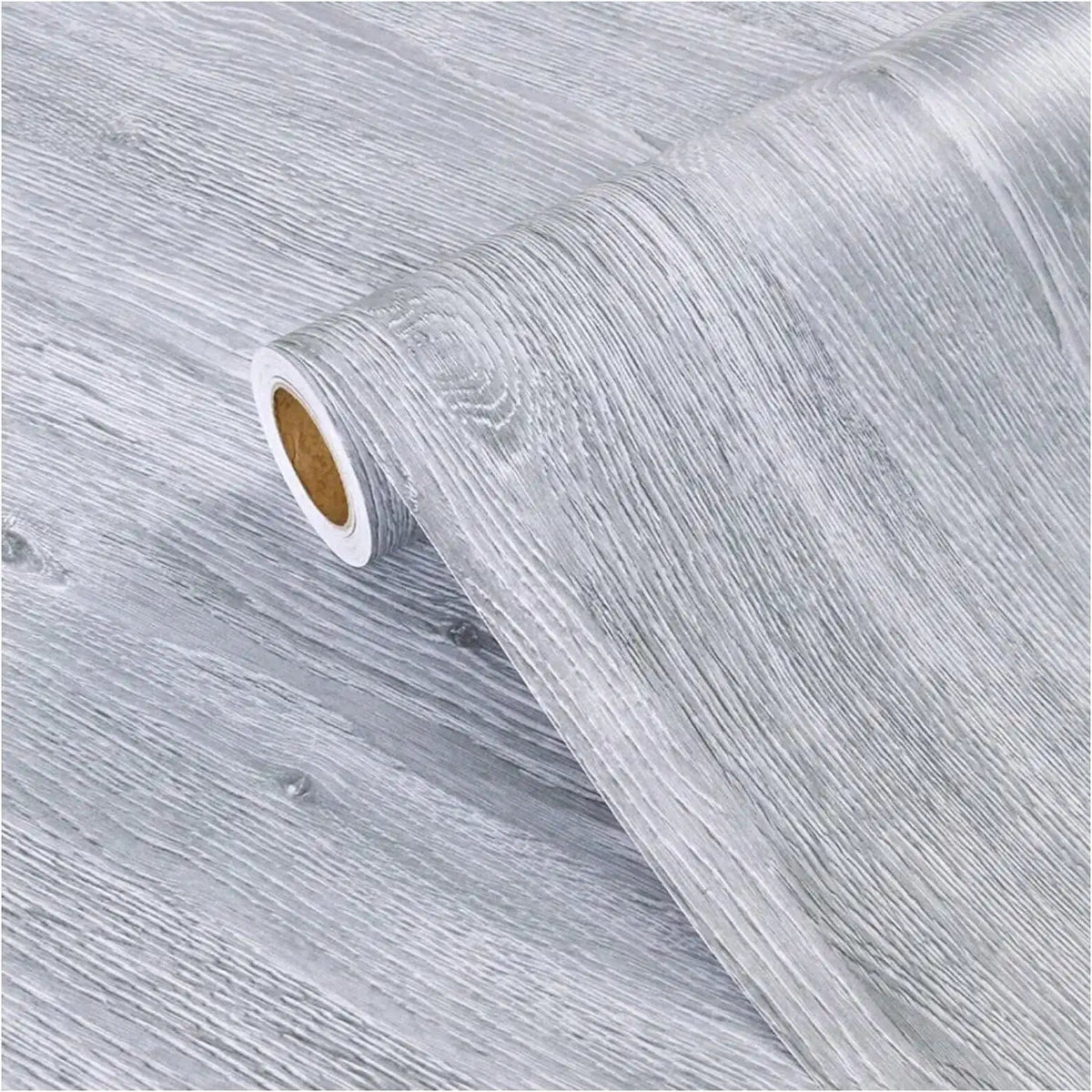 Roll of gray wood grain vinyl wallpaper contact paper showing a peel and stick edge.