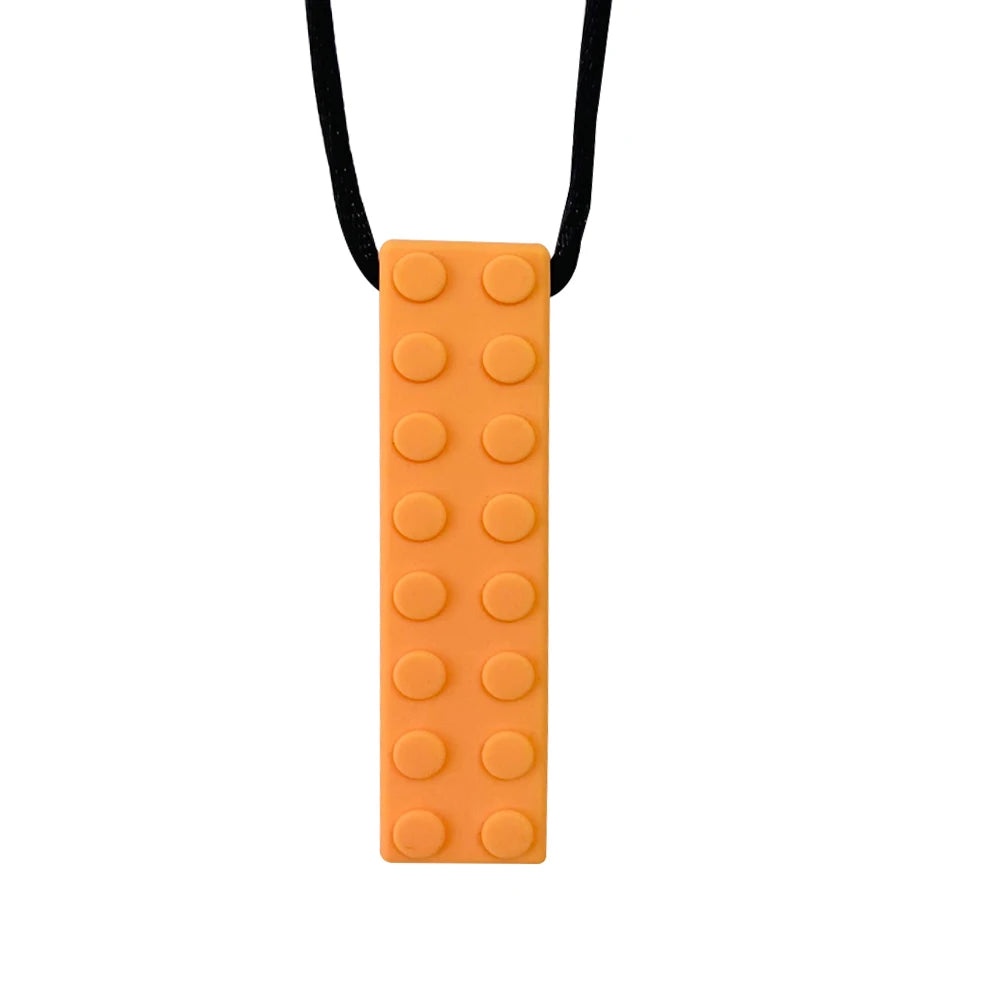 An orange silicone sensory chew necklace for kids with a black cord.
