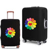 Black suitcase with a daisy print graphic on the side