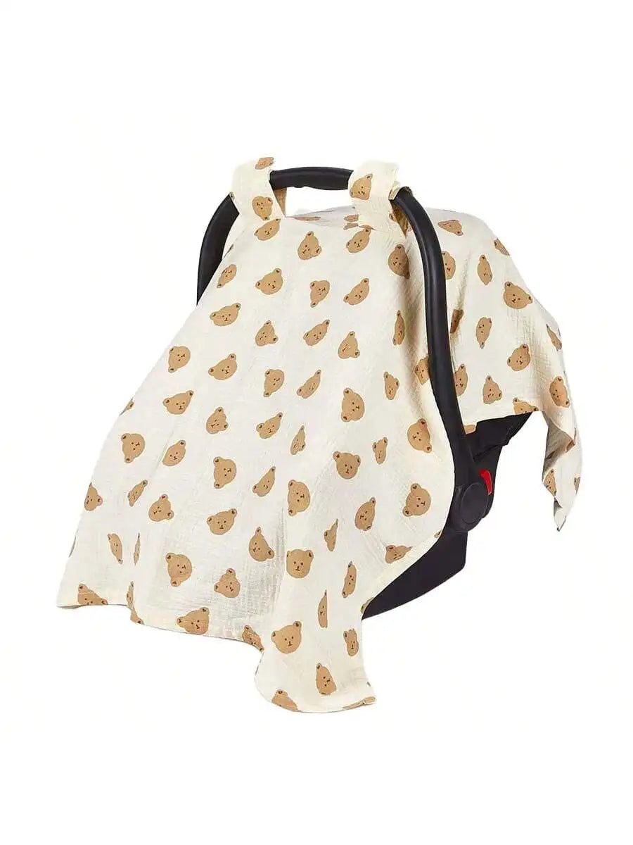 A beige breathable stroller cover featuring a pattern of small brown leaves and a black handle.