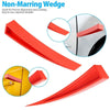 Red non-marring wedge tool for precise alignment and leveling used on a car door.