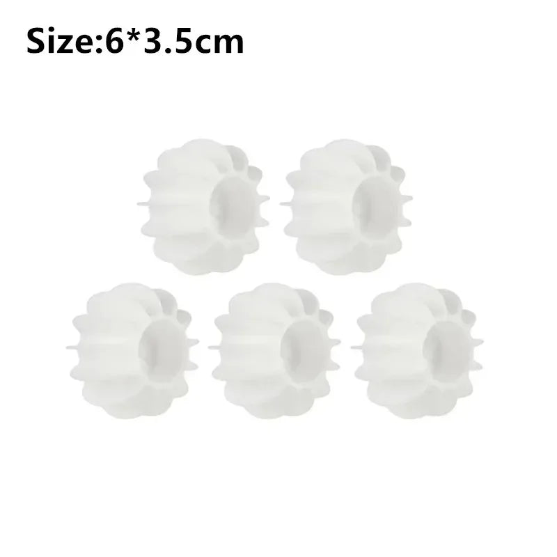 Six white reusable laundry balls designed for pet hair and lint removal
