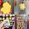 A collection of colorful magnetic stickers displayed on a wooden surface.