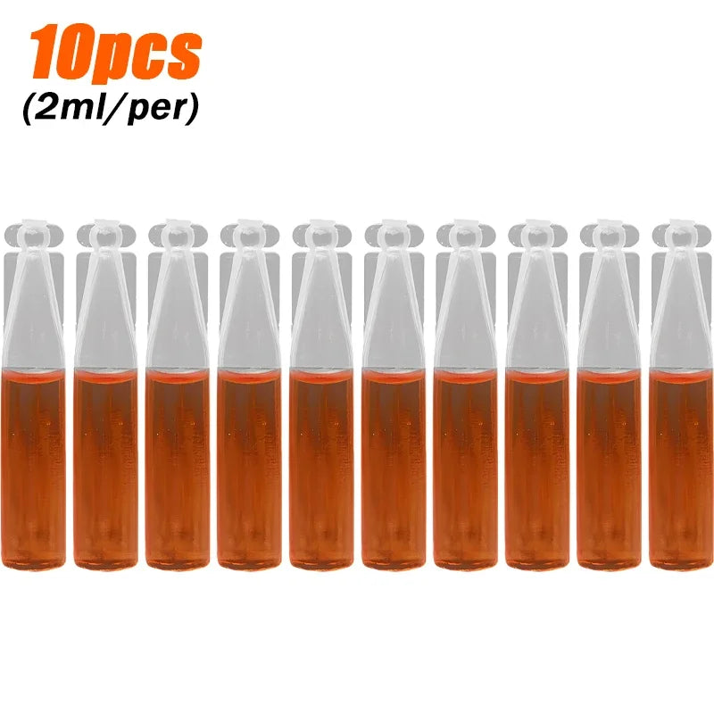 A set of ten small glass vials containing an orange liquid, labeled as a fruit fly trap kit.
