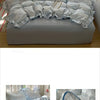 A light blue floral duvet cover set with matching pillowcases and a flat sheet displayed on a bed.