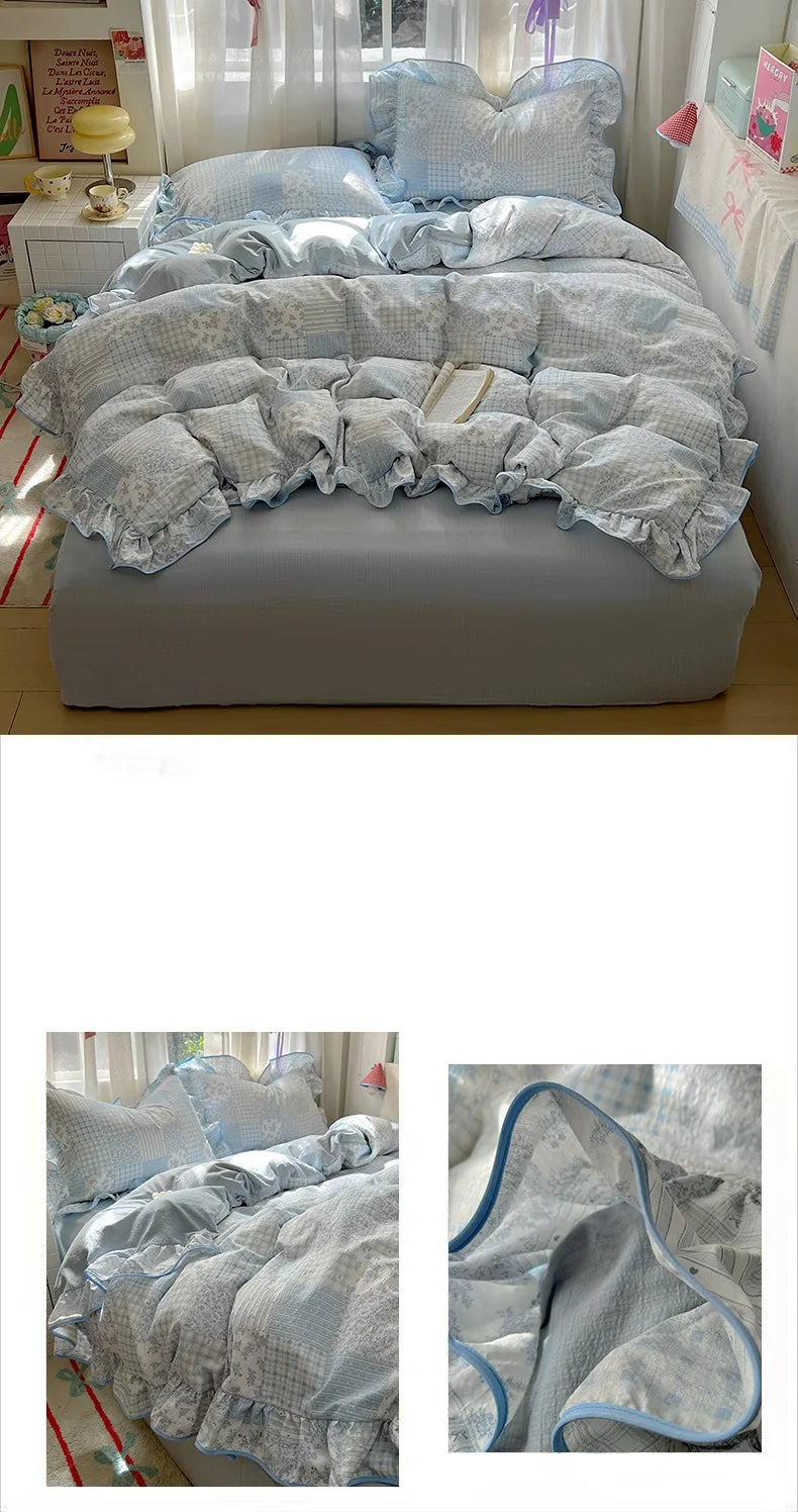 A light blue floral duvet cover set with matching pillowcases and a flat sheet displayed on a bed.