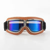 A pair of brown leather retro foldable motorcycle goggles with blue tinted lenses.