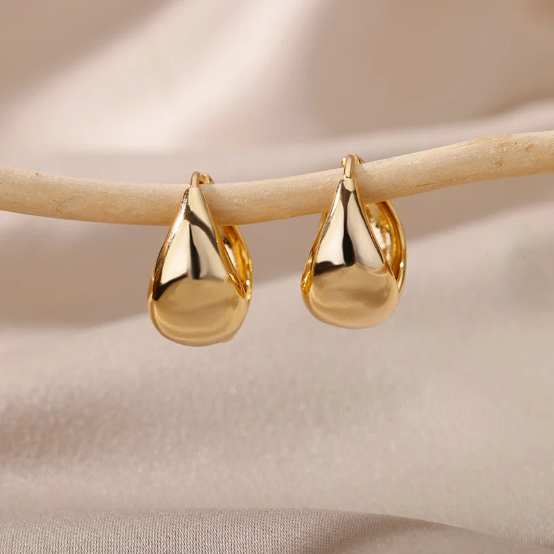 Boucles d'oreilles créoles en zircon cubique ton or
