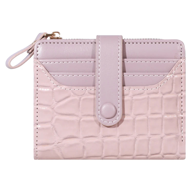 A light pink women's double-zip PU leather wallet with card slots and a flap closure.