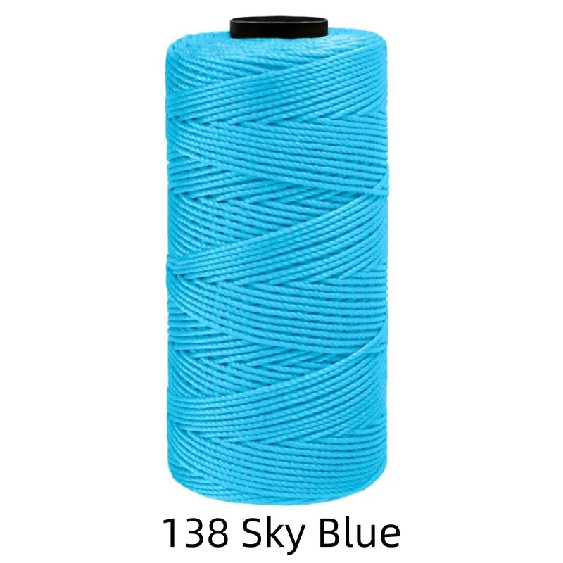 A spool of bright sky blue ice silk crochet yarn for knitting and DIY crafts.