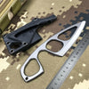 A black fixed-blade neck knife is shown next to a silver measuring ruler on a camouflage background.