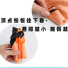 An orange hand-throw parachute toy with a mini soldier is being held by a hand.