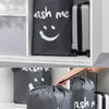 A large black drawstring laundry bag is shown being used for storage and travel.