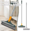 A double-sided cleaning brush with a long handle and a flat scrubbing head shown on a wooden floor.