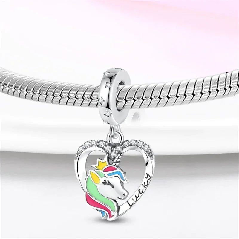 Silver chain necklace with a heart pendant featuring a unicorn pegasus and rainbow colors