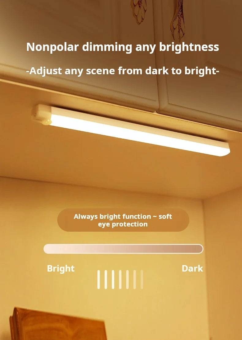 A long, white LED light bar is installed under a cabinet, demonstrating nonpolar dimming from bright to dark settings.
