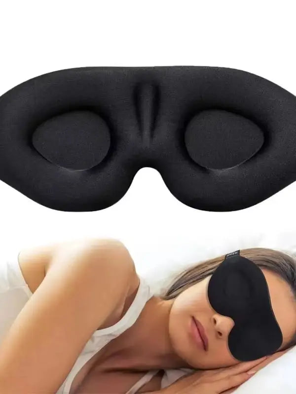 A black 3D contoured silk-touch sleep mask is shown being worn by a person.