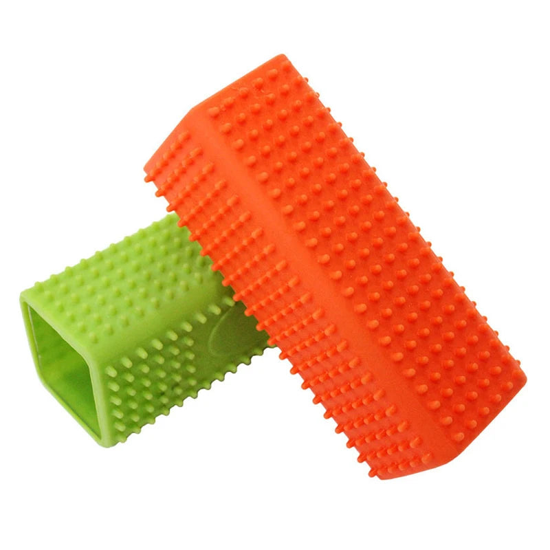 Orange silicone pet hair remover brush with green silicone tool attached