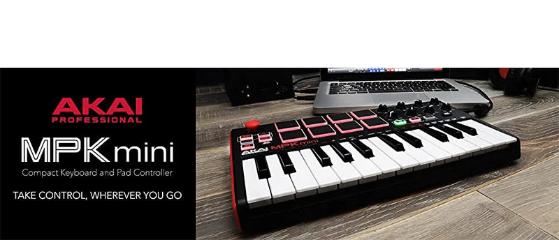 Black AKAI Professional MPK Mini keyboard controller with drum pads and knobs on a wooden surface.