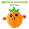 An orange fruit-shaped plush toy resembling a carrot with green leafy top.
