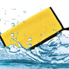 Yellow microfiber car cleaning towel being used to wipe away water droplets from a surface.