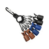 A collection of squid jig protectors and hooks attached to a black carabiner.