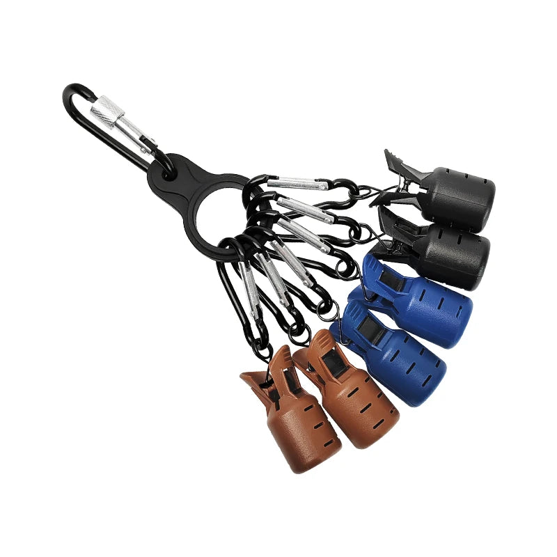 A collection of squid jig protectors and hooks attached to a black carabiner.