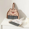 A set of pink cartoon-themed broom and dustpan for tabletop cleaning