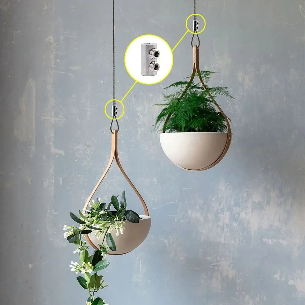 Stainless steel wire rope clamps used to suspend a potted plant from a hanging wooden hanger.