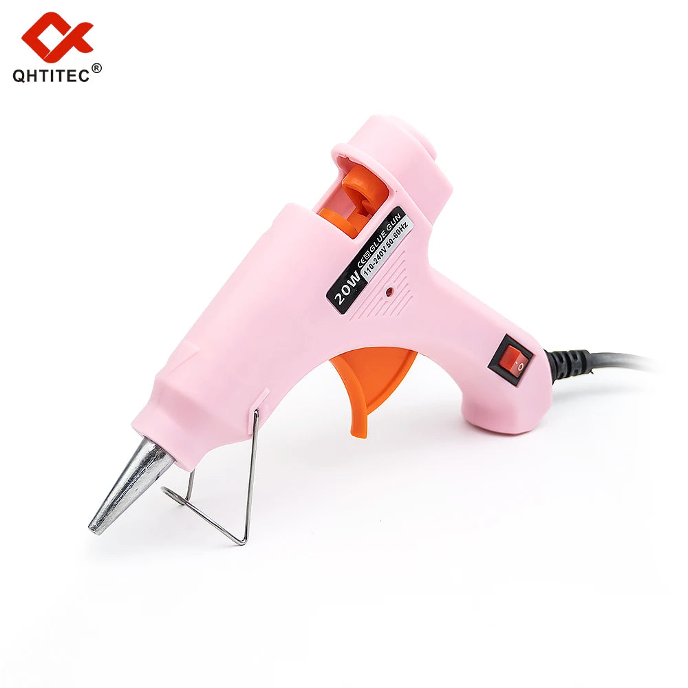 A pink hot melt glue gun with an orange handle and a black cord, shown against a white background.