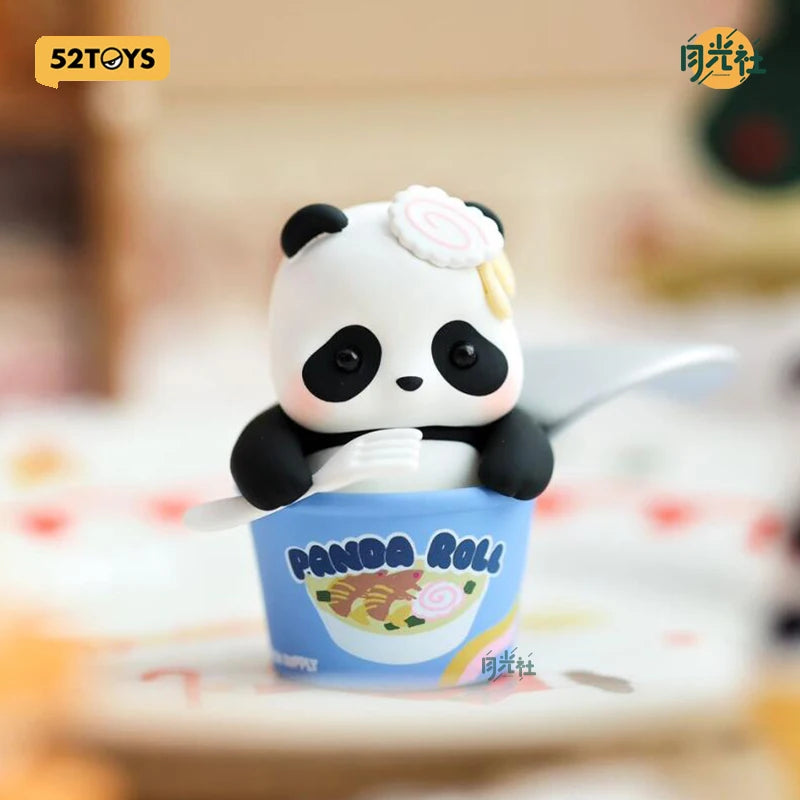 A cute panda blind box figure sitting in a blue cup with food inside.