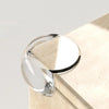 Clear silicone corner edge guards for baby safety resting on a light beige surface.