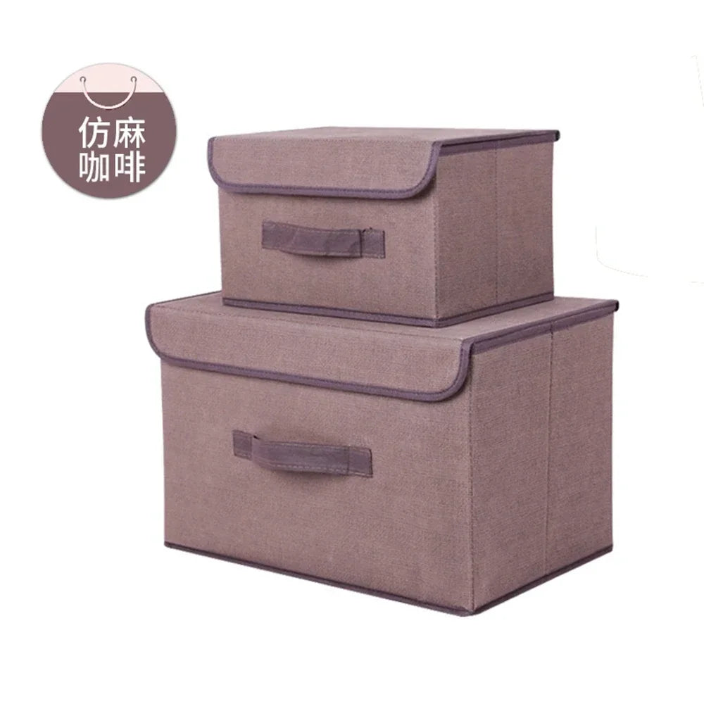 A set of two rectangular fabric storage boxes in a dusty rose color for closet and drawer organization.