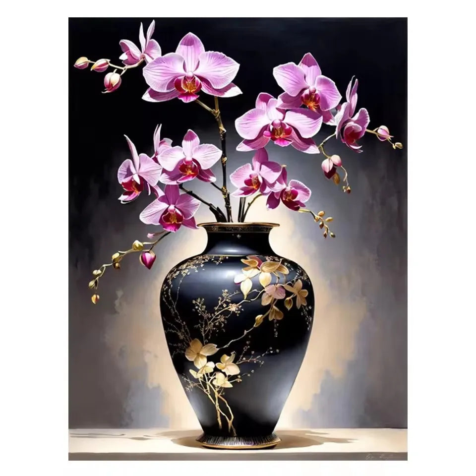 A black ceramic vase holds pink orchids against a dark background.