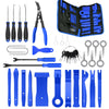 A collection of blue and black car trim removal tools, including pliers, cutters, and various specialized tools, stored in a 