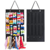 A black hair bow and clip organizer with colorful fabric bows and clips hanging from a rope hanger.