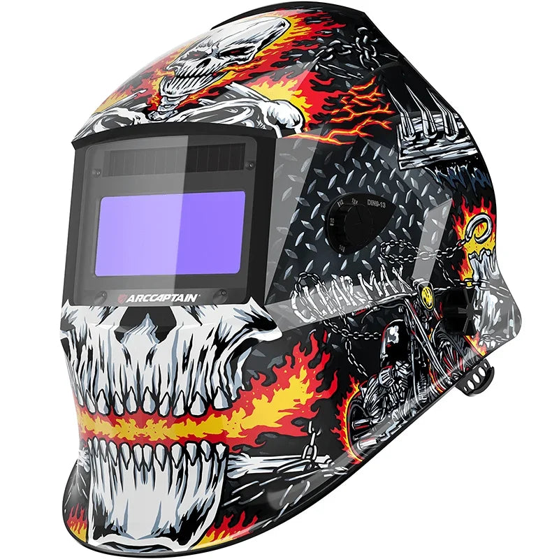 A black and white auto-darkening welding helmet with a skull design and a purple lens.