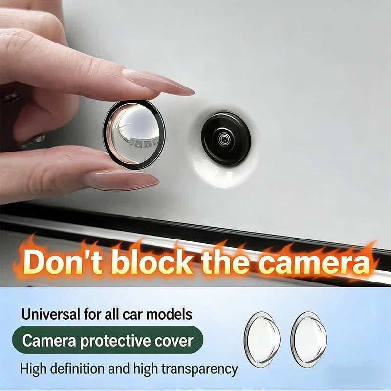 A hand is placing a clear protective cover over a car camera lens on a silver surface.
