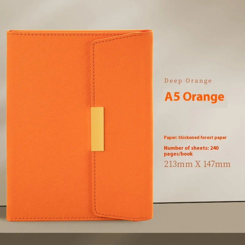 A Deep Orange A5 journal notebook with a yellow closure tab and forest paper.