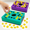 A hand is interacting with a purple shape matching puzzle game, showing yellow puzzle pieces on the board.