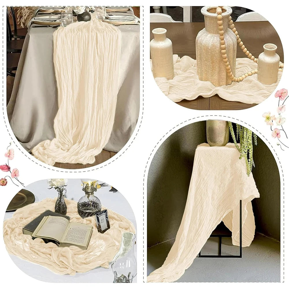 A semi-sheer beige gauze table runner draped elegantly on a wooden table with decorative glass bottles and floral accents.