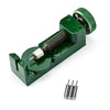 A green watch band link remover and pin extractor kit with a threaded tool and multiple pins.