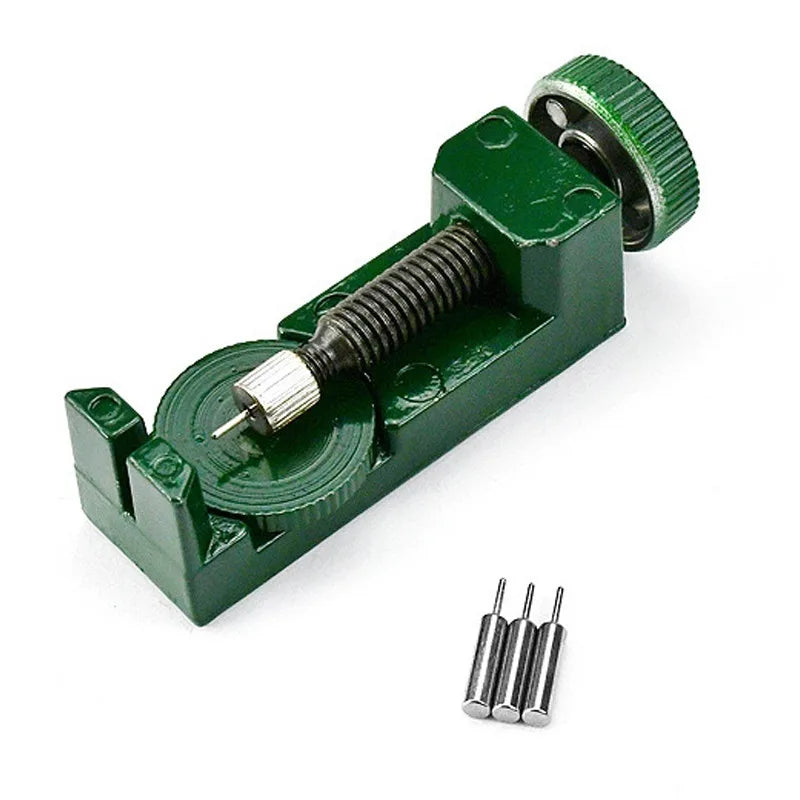 A green watch band link remover and pin extractor kit with a threaded tool and multiple pins.