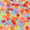 A collection of colorful acrylic alphabet letter beads in various shades of red, orange, green, and purple.