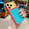 A hand holds a pink and yellow color blocking shockproof phone case with a large camera window.