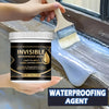 A hand is applying a clear liquid waterproofing agent onto a window frame with a paint brush.