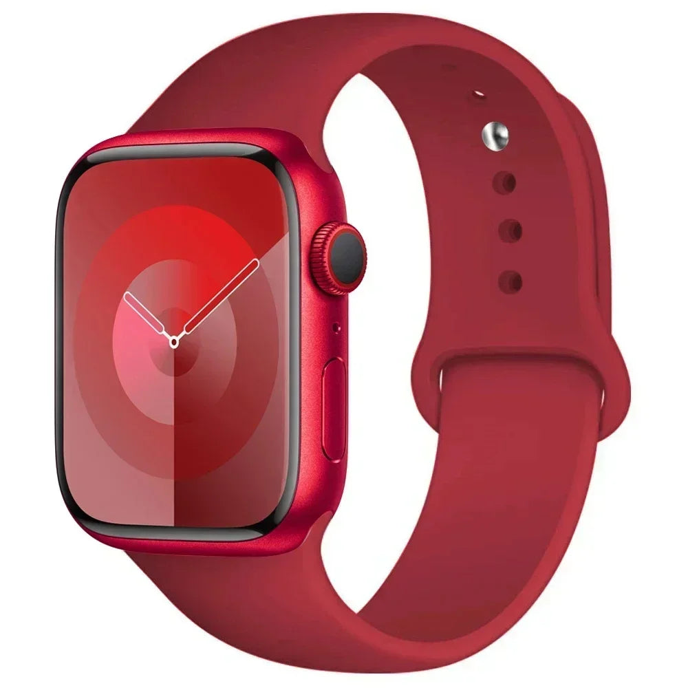 A red silicone sport band for an Apple Watch shown on a white background.