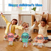 Three children are playing with interactive dancing jellyfish toys that light up and move on a wooden floor.