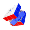 A red and blue speed cube with white markings is shown at an angle.
