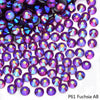 Close-up of purple and pink faceted rhinestones used for DIY crafts and clothing decoration